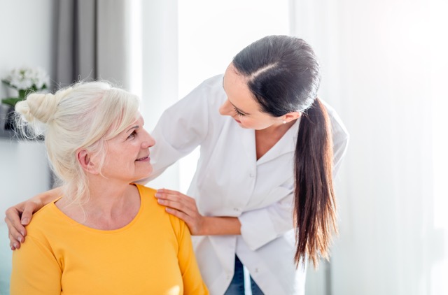 Caregiver supporting adult family member with communication near Timonium, MD